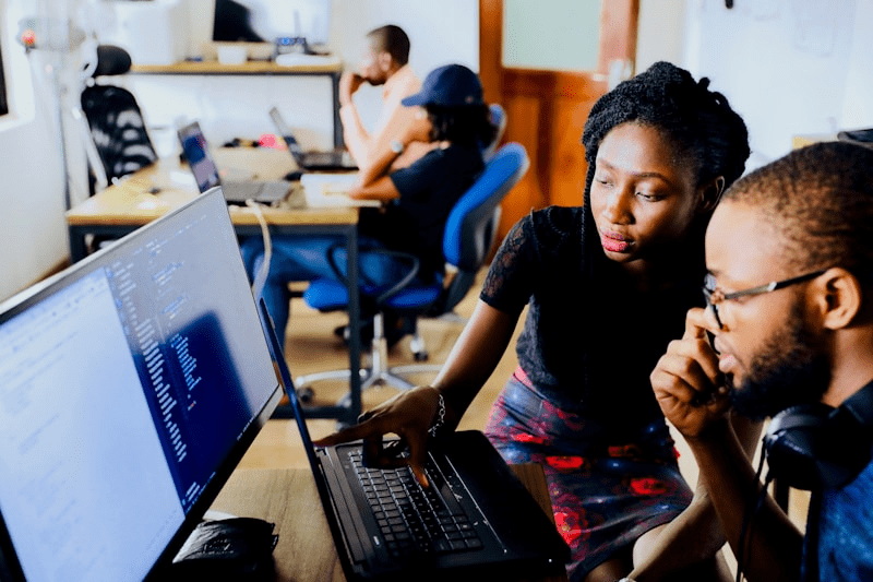 Software engineer coding on monitor